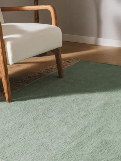 Alfombra artesanal de lana con flecos Liv