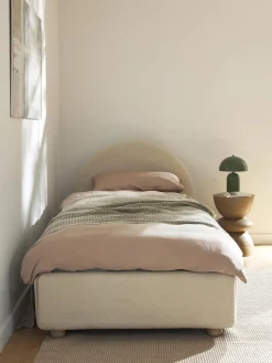 Cama individualde borreguillo Ebba, con espacio de almacenamiento