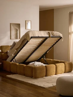 Cama tapizada de boreguillo bouclé con espacio de almacenamiento Tayla