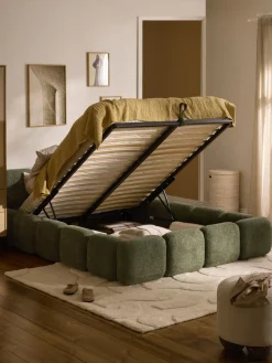 Cama tapizada de boreguillo bouclé con espacio de almacenamiento Tayla