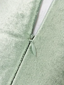 Cojín rulo co flecos Nikita