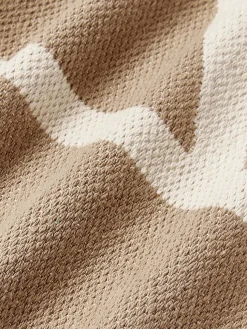 Funda de cojín artesanal con motivos geométricos Asta