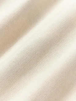 Funda de cojín artesanal con motivos geométricos Asta