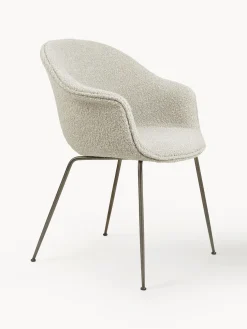 Silla con reposabrazos en tejido bouclé Bat