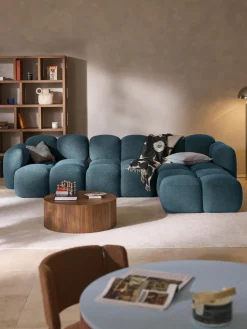 Sofá modular en tejido bouclé con reposapiés Tayla (4 plazas)