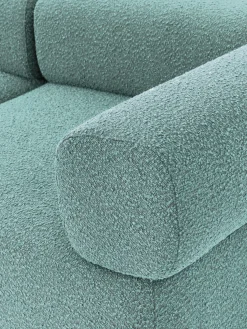 Sofá modular en tejido bouclé Anton (4 plazas), con reposapiés (izquierda/derecha)